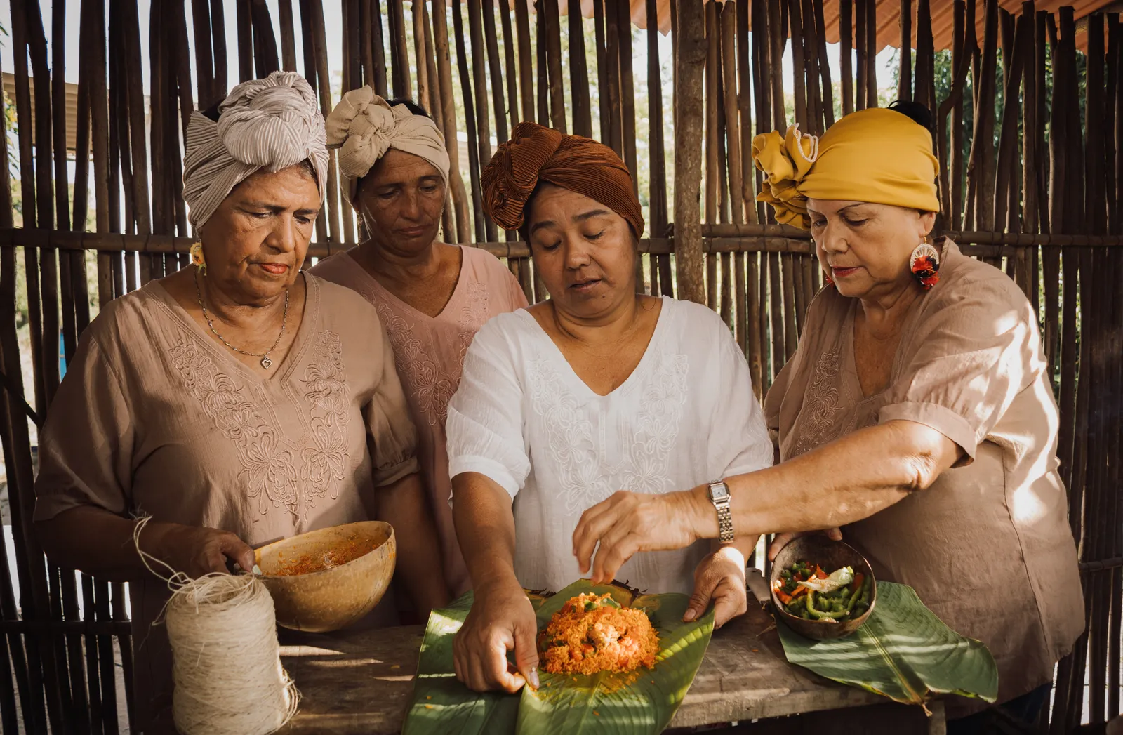 Women preparing food in a traditional kitchen